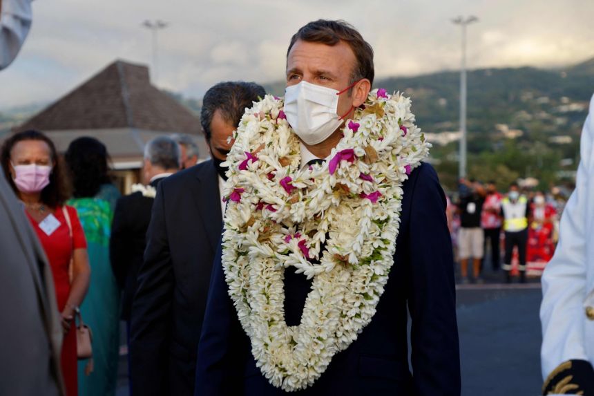 Mr Emmanuel Macron is welcomed upon his arrival at Faa'a international airport for a visit to Tahiti in French Polynesia, on July 24, 2021.