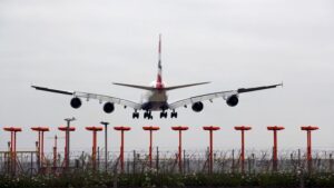 A plane lands on a runway at Heathrow airport. Pic: PA