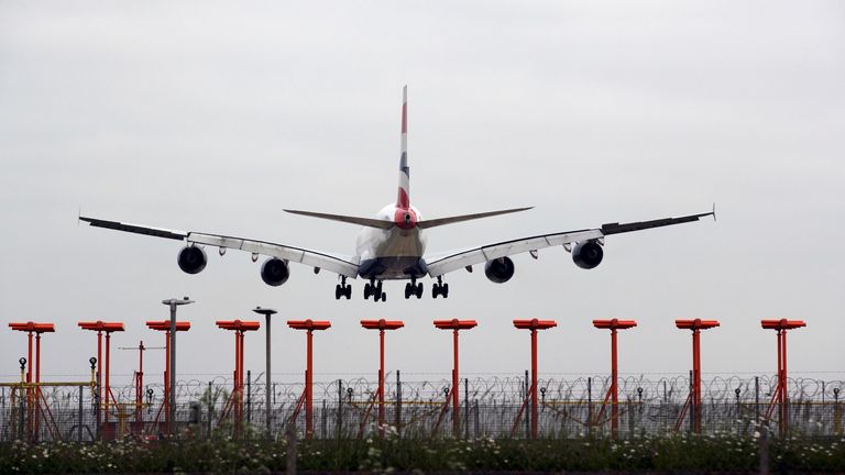 A plane lands on a runway at Heathrow airport. Pic: PA