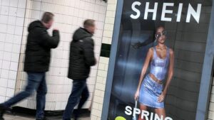 People walk past an advertisement for Shein, in London, Britain, March 8, 2024. REUTERS/Suzanne Plunkett